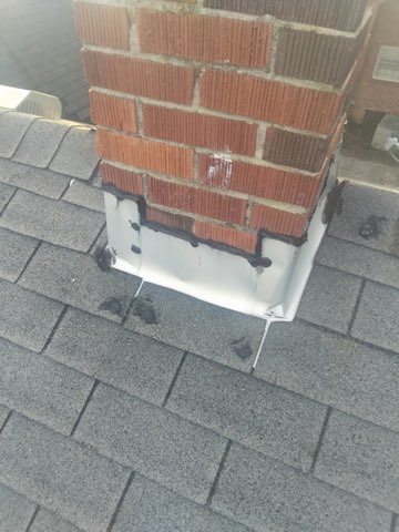 New chimney base flashing installed and sealed watertight