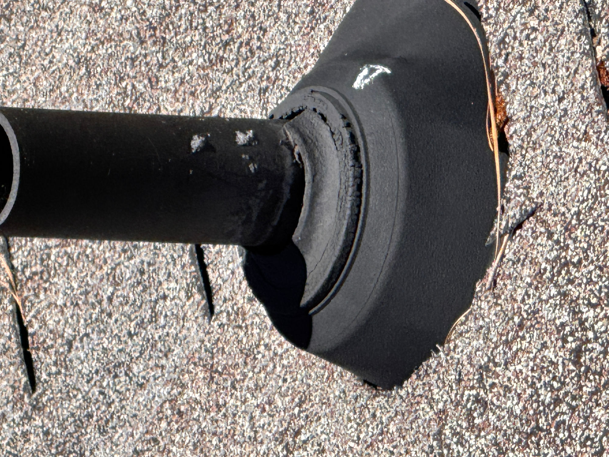 New pipe boot installed to seal the vent stack and keep the roof watertight