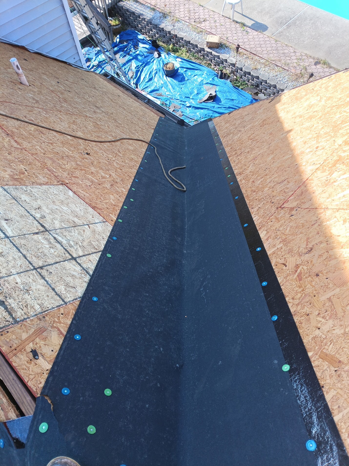 New decking with peel-and-stick ice-and-water membrane running the full valley for leak protection