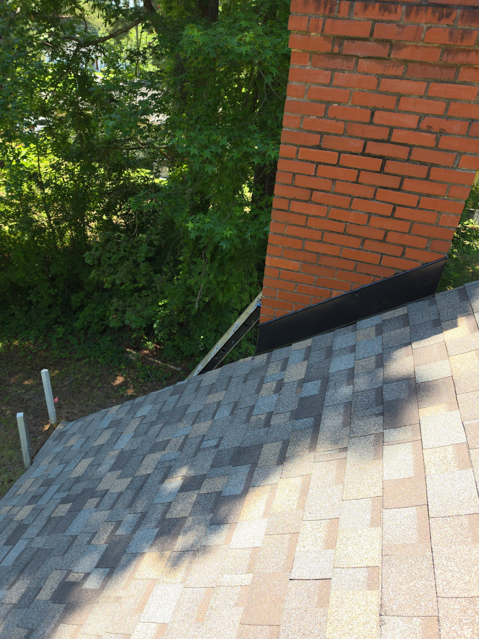 New chimney flashing installed and sealed watertight against the brick