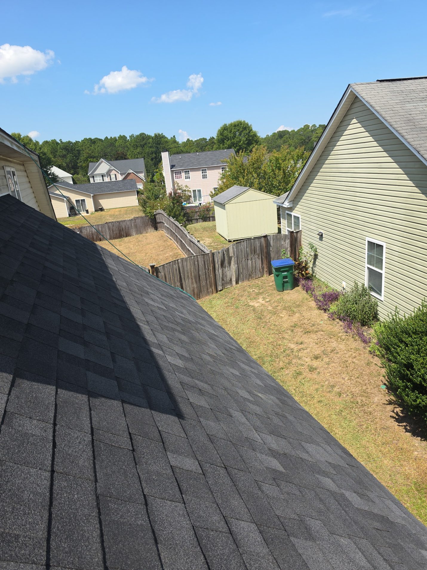 Finished: the side slope in new shingles, laid in straight courses from the ridge to the eave