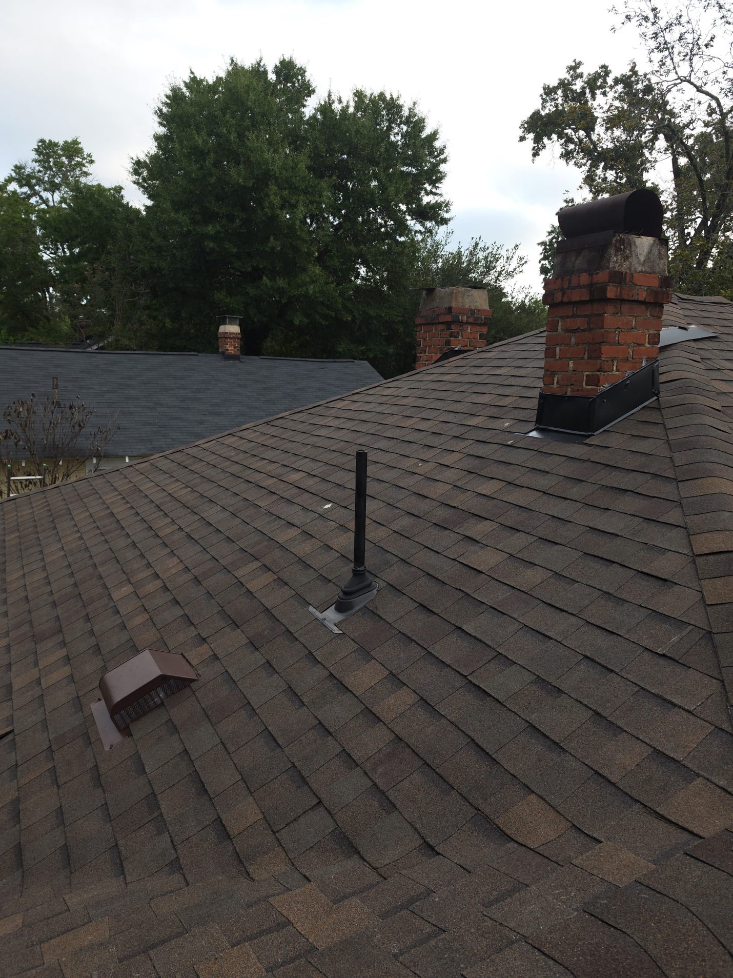 Finished: new architectural shingles with a new hooded roof vent, a new boot on the plumbing vent